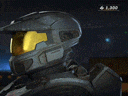 a man wearing a helmet with a yellow visor is standing in a dark room