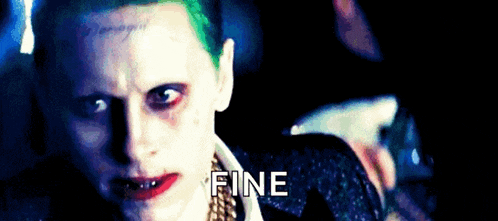 a close up of the joker 's face with the word fine written below him