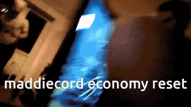 a blurry picture of a person with the words maddiecord economy reset on the bottom