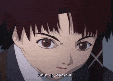 a close up of a girl 's face with the words shut up damn it below her