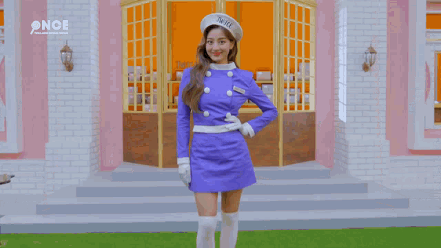 a woman wearing a beret with twice written on it