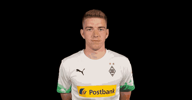 a man wearing a white shirt with a yellow stripe that says postbank on it