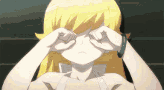 a girl with blonde hair is rubbing her eyes with her hands .