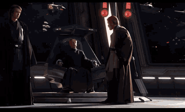 a man in a black cape is standing in front of stairs