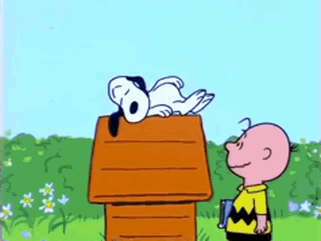 snoopy and charlie brown are standing next to a doghouse
