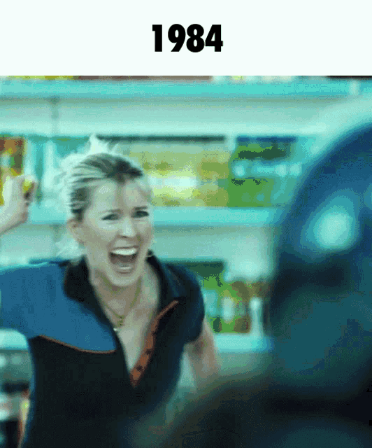 a woman is screaming in front of a shelf with the year 1984 above her