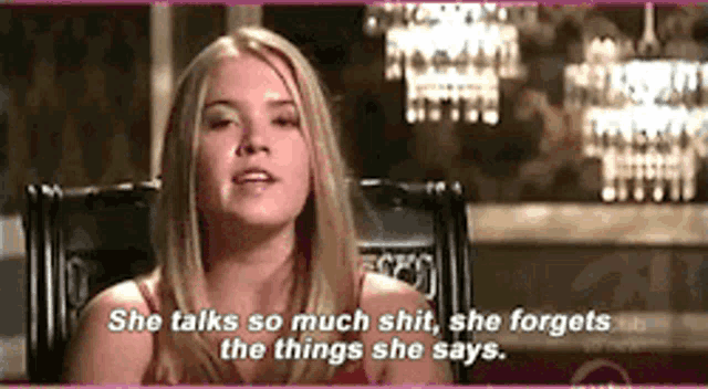 a woman is sitting in a chair and saying she talks so much shit , she forgets the things she says .