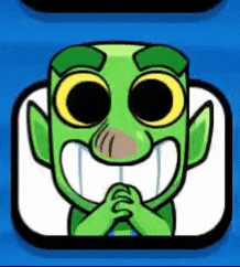 a green cartoon character with big eyes and a big smile on his face is sitting on a blue background .