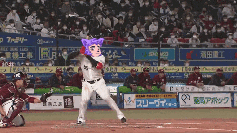 a baseball player with a purple cat on his head is swinging at a pitch