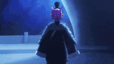 a person with a purple mask on their face is standing in a dark room