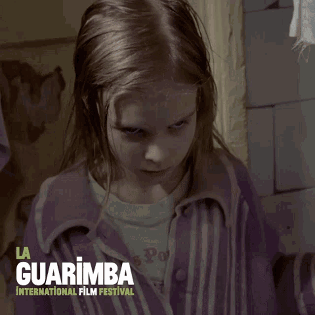 a poster for the la guarimba international film festival shows a little girl