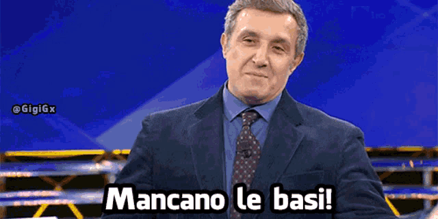 a man in a suit says mancano le basi