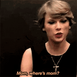 a woman with a cross necklace is asking where 's mom