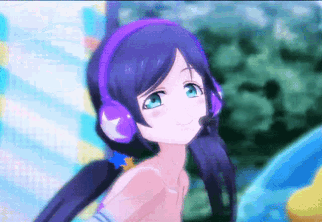 a girl wearing purple headphones and a microphone smiles