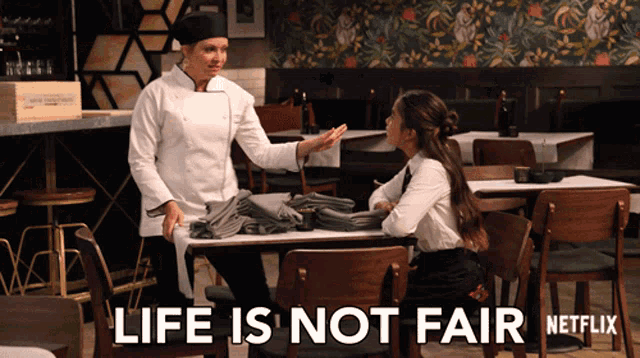 a netflix ad shows a chef talking to a waitress in a restaurant
