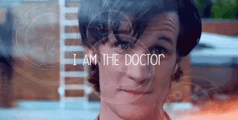 a close up of a man 's face with the words `` i am the doctor '' behind him