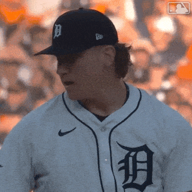 a baseball player wearing a jersey with the letter d on the front