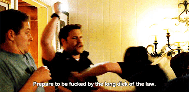 a man says " prepare to be fucked by the long dick of the law " in a room