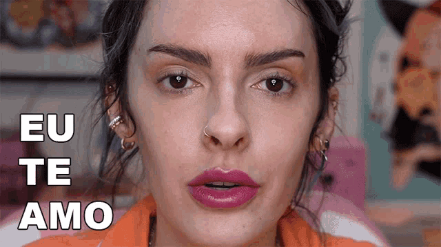 a close up of a woman 's face with eu te amo written on the bottom