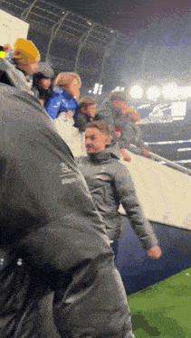 a man wearing a jacket that says ridgeline on the back