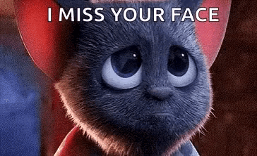 a cartoon cat with a sad look on its face and the words `` i miss your face '' written above it .