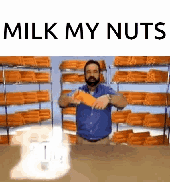 a man with a beard is holding a carrot in front of shelves of carrots ..