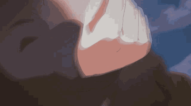 a close up of a person 's face with a hand on it