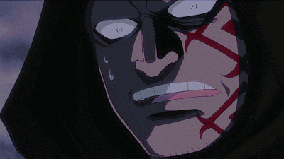 a close up of a person 's face with a black hood on