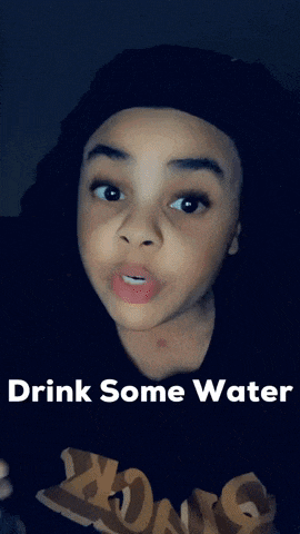 a young boy with the words drink some water written on the bottom