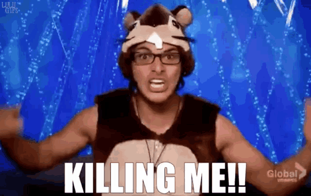 a man in a squirrel costume is saying " killing me "