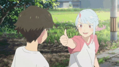 a girl giving a thumbs up to a boy