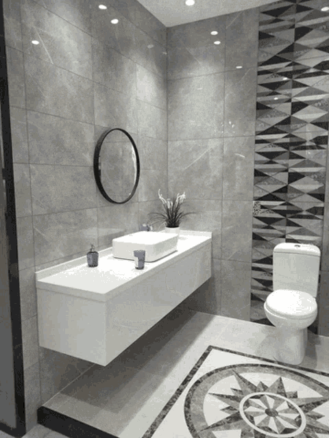 a bathroom with a sink and a toilet with a compass pattern on the floor