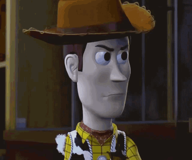 a close up of a toy story woody making a funny face