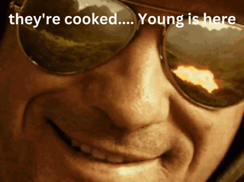 a man wearing sunglasses is smiling with the words they 're cooked young is here