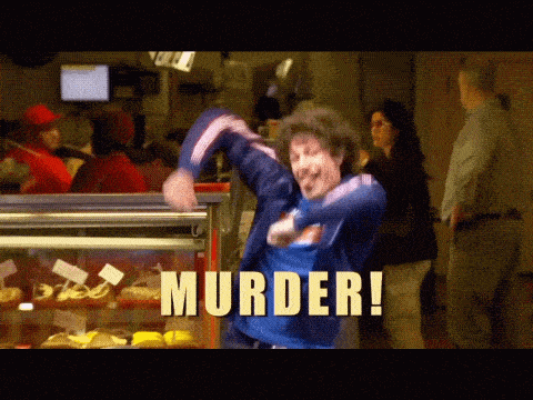 a man in a blue jacket is dancing in front of a display case with the words murder written on it