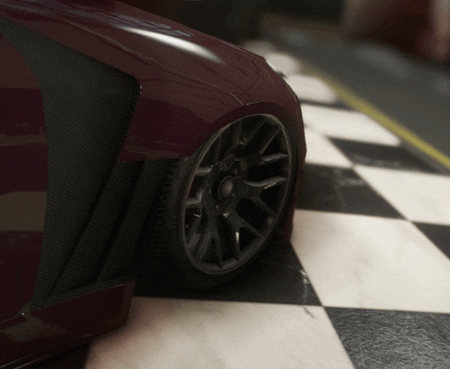 a purple car is parked on a checkered tile floor