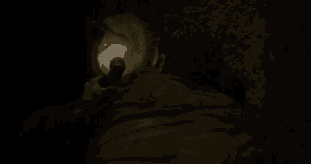 a blurry picture of a dark room with a few lights