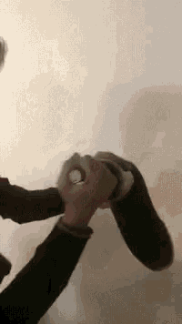 a person is putting a sock on another person 's feet .