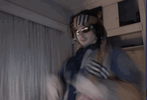 a person giving the middle finger in a room