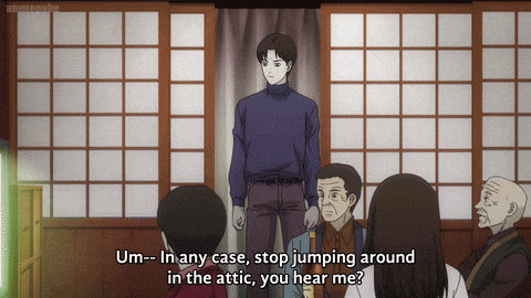 a man stands in front of a group of people and says um- in any case stop jumping around in the attic