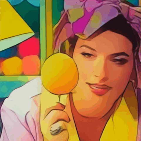 a woman in a yellow robe is holding a yellow lollipop