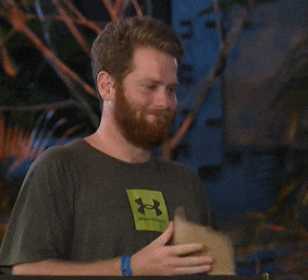 a man with a beard wearing a green under armour shirt