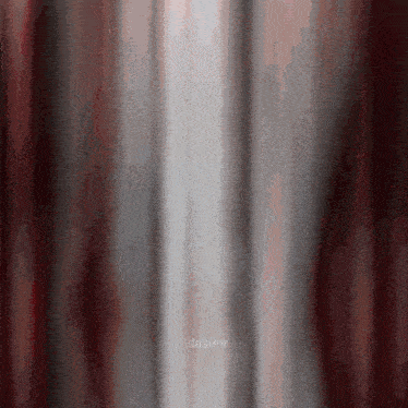 a blurred image of a red and white curtain with the word daskv visible