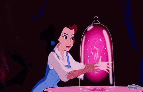 belle from beauty and the beast is sitting at a table with a pink flower coming out of her hand .