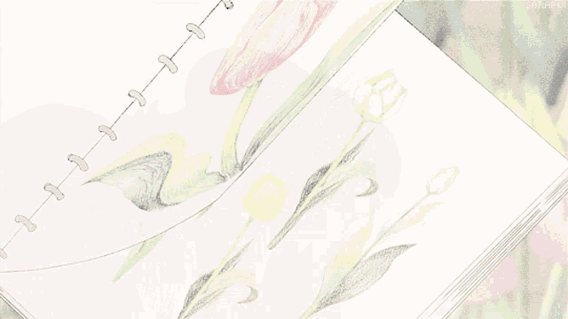 a drawing of a pink flower is on a notebook with a spiral bound