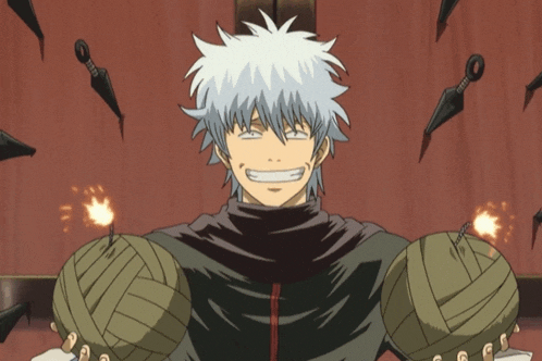 a man with a bandage on his arm is smiling in front of knives