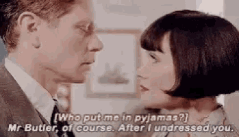 a man and a woman are looking at each other and the woman is saying `` who put me in pajamas ? ''