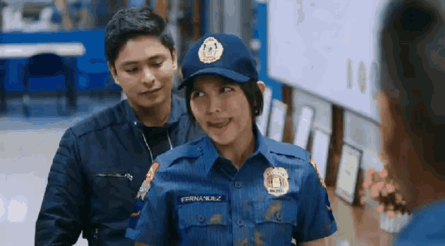 a woman in a police uniform with the name fernandez on her shirt