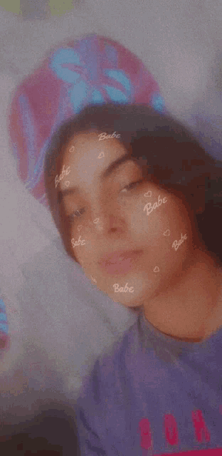 a girl with babe written on her face