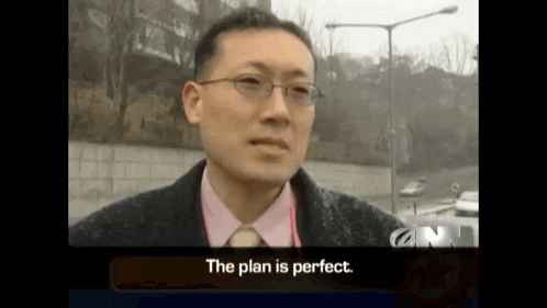 a man wearing glasses and a pink shirt is talking about the plan being perfect .